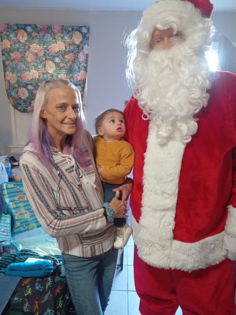 Kid meets Santa for his first time.